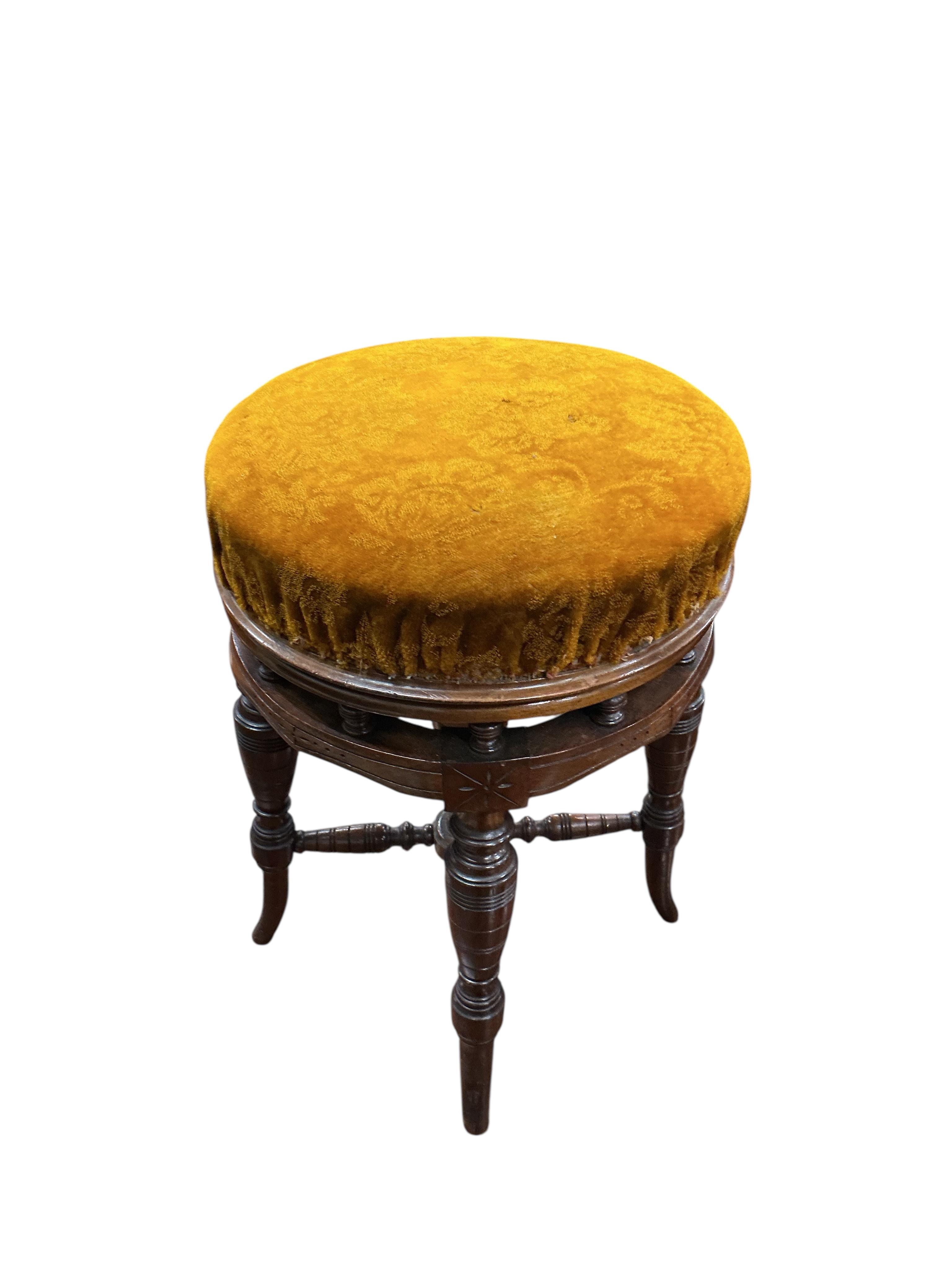 A late Victorian mahogany adjustable revolving piano stool